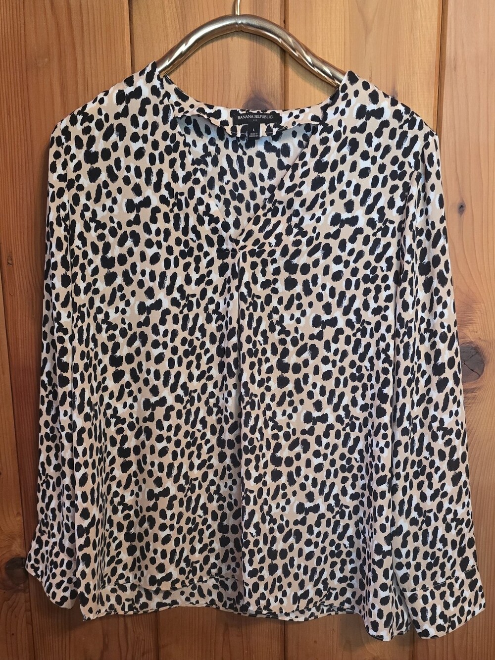 Banana Republic blouse features a distinctive leopard print pattern